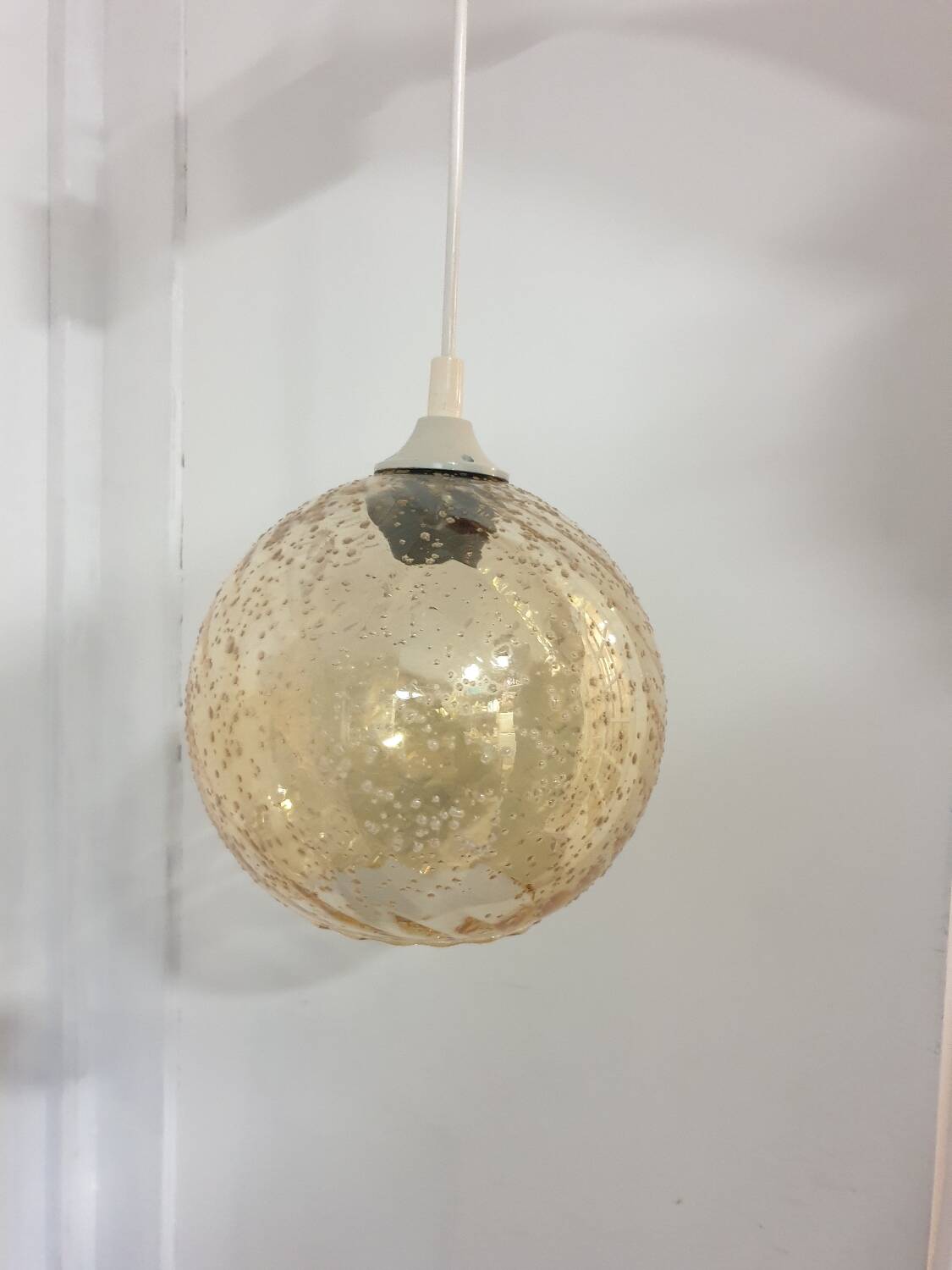 Vintage globe pendant in amber bubble glass