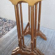 Sets of three nesting tables with painted landscape decorations in poplar.