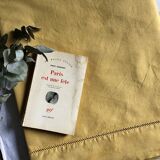 Old linen and cotton sheet tinted in curry yellow