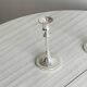 Pair of white metal candlesticks