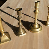 Set of 4 old candle holders in golden brass