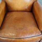 Ensemble de 2 fauteuils en cuir de mouton avec finition passepoil noir