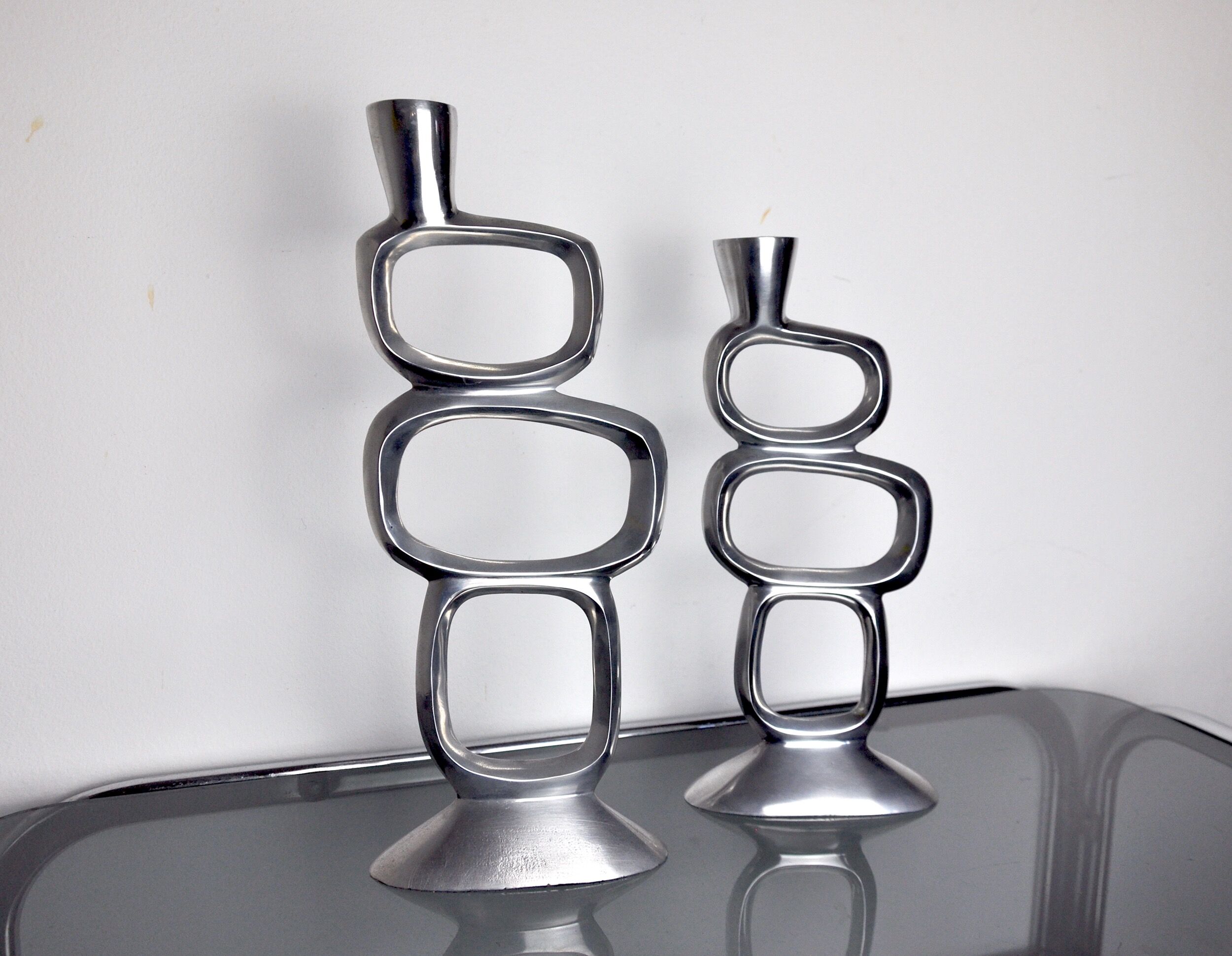 Pair of circle candlesticks by matthew hilton, england, 1980