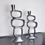 Pair of circle candlesticks by matthew hilton, england, 1980