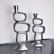 Pair of circle candlesticks by matthew hilton, england, 1980