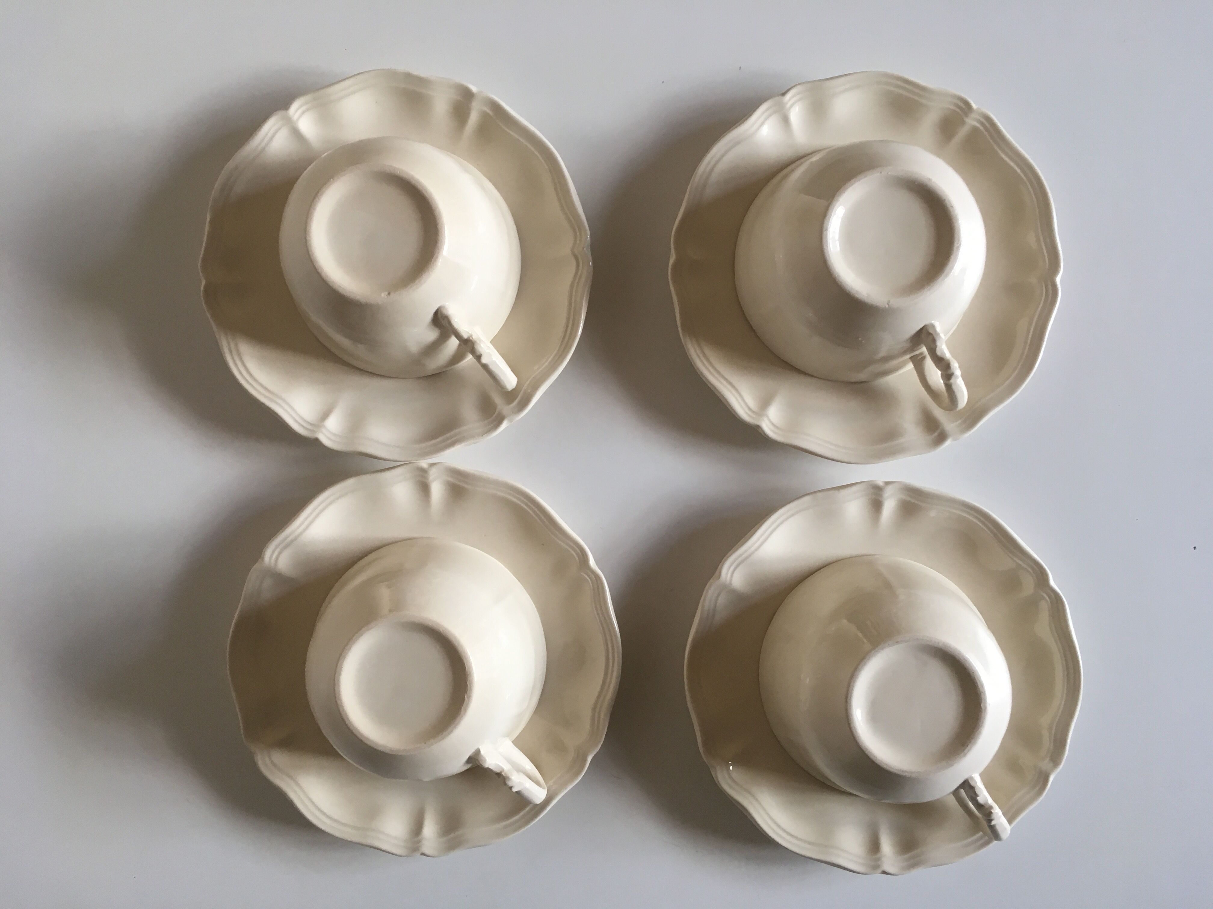 Set of 4 cups breakfasts in faience Sarreguemines ivory to godrons