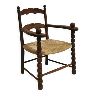 Armchair in solid oak and straw