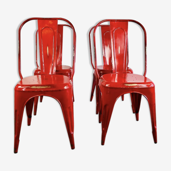 Set of four low chairs in red steel
