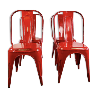 Set of four low chairs in red steel