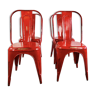Set of four low chairs in red steel