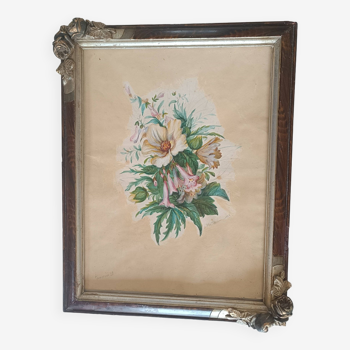 Frame from the 1920s. In brown wood with 2 decorative bouquet angles in relief.