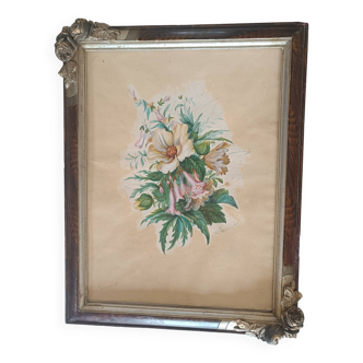 Frame from the 1920s. In brown wood with 2 decorative bouquet angles in relief.