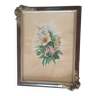 Frame from the 1920s. In brown wood with 2 decorative bouquet angles in relief.
