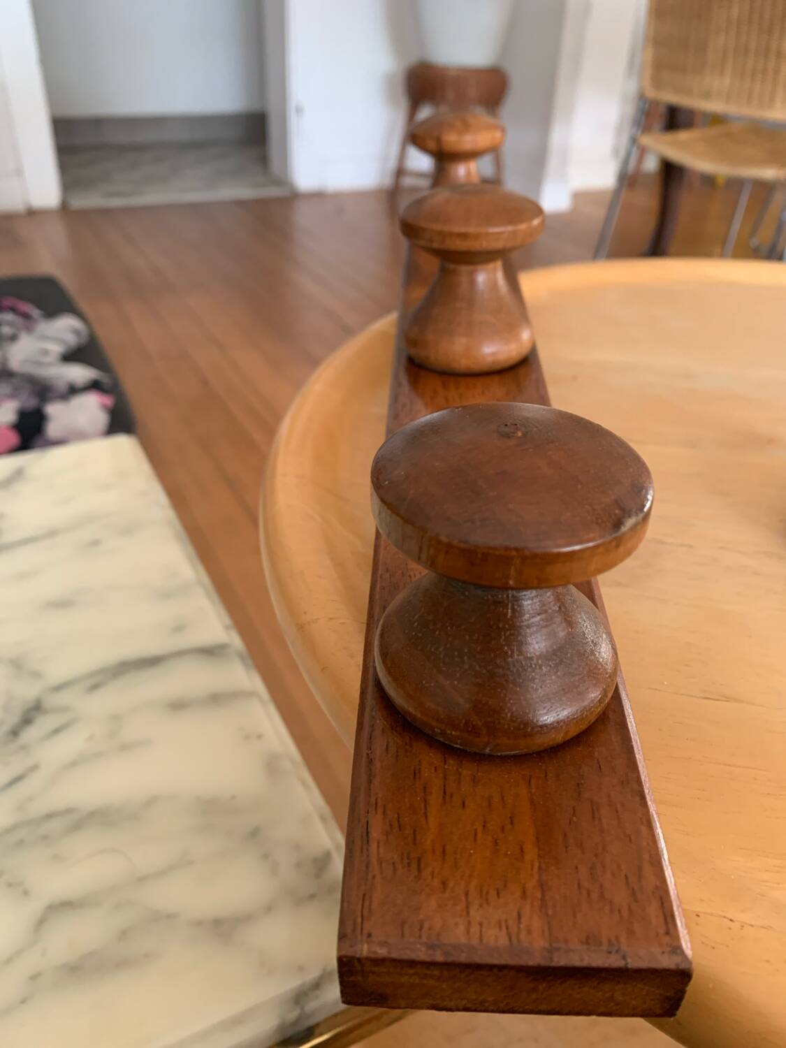 Wooden wall-mounted coat rack