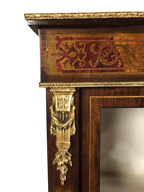 Varnished wood showcase and gold decoration in imitation of the so-called Boulle marquetry