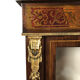 Varnished wood showcase and gold decoration in imitation of the so-called Boulle marquetry
