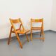 Pair of vintage folding chairs in pine from the 70s and 80s.