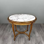 Oval guéridon table in carved wood and marble, Louis XVI style, 19th century.