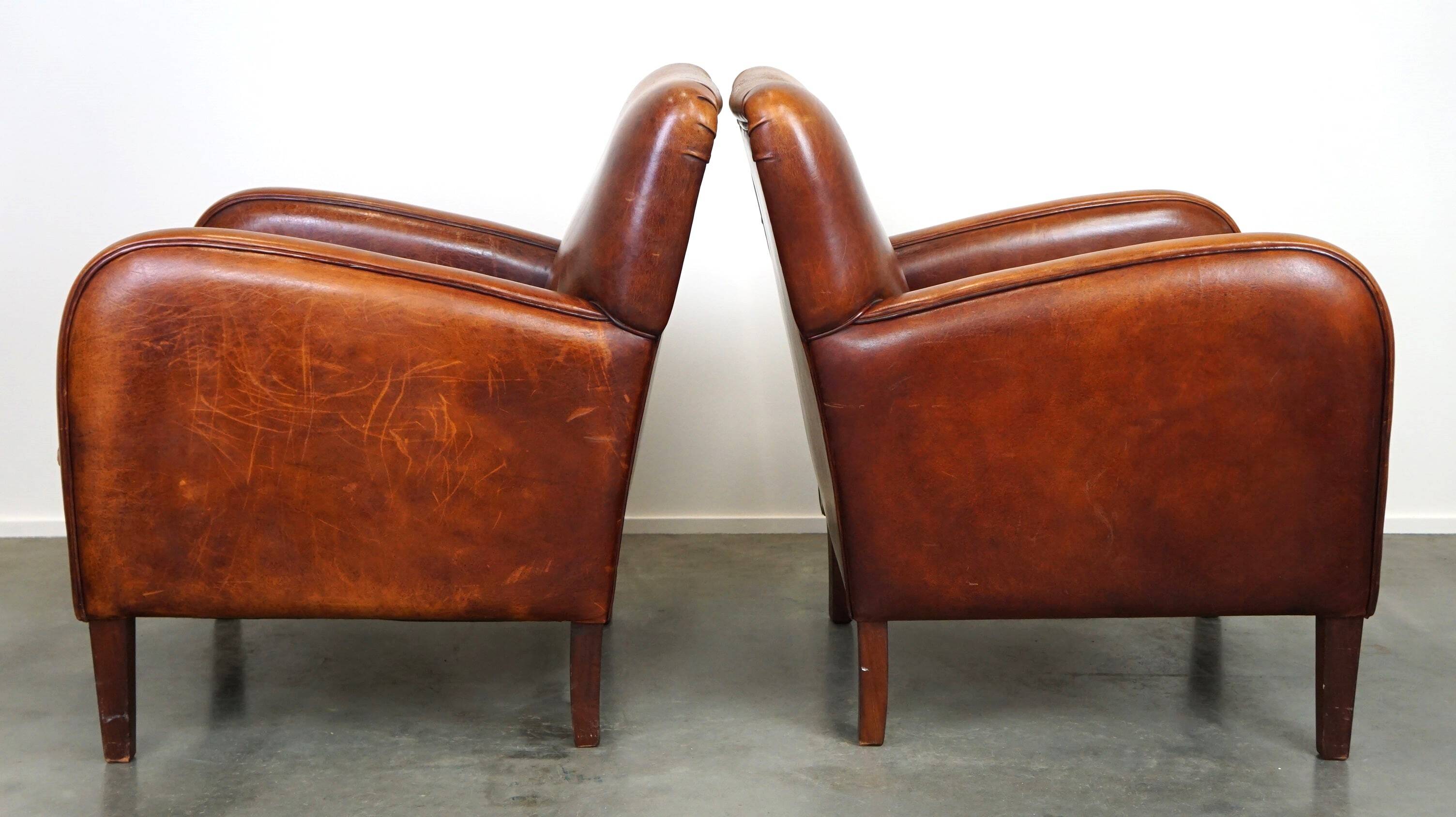 Set of 2 subtle sheepskin leather armchairs with a beautiful warm color scheme