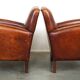 Set of 2 subtle sheepskin leather armchairs with a beautiful warm color scheme