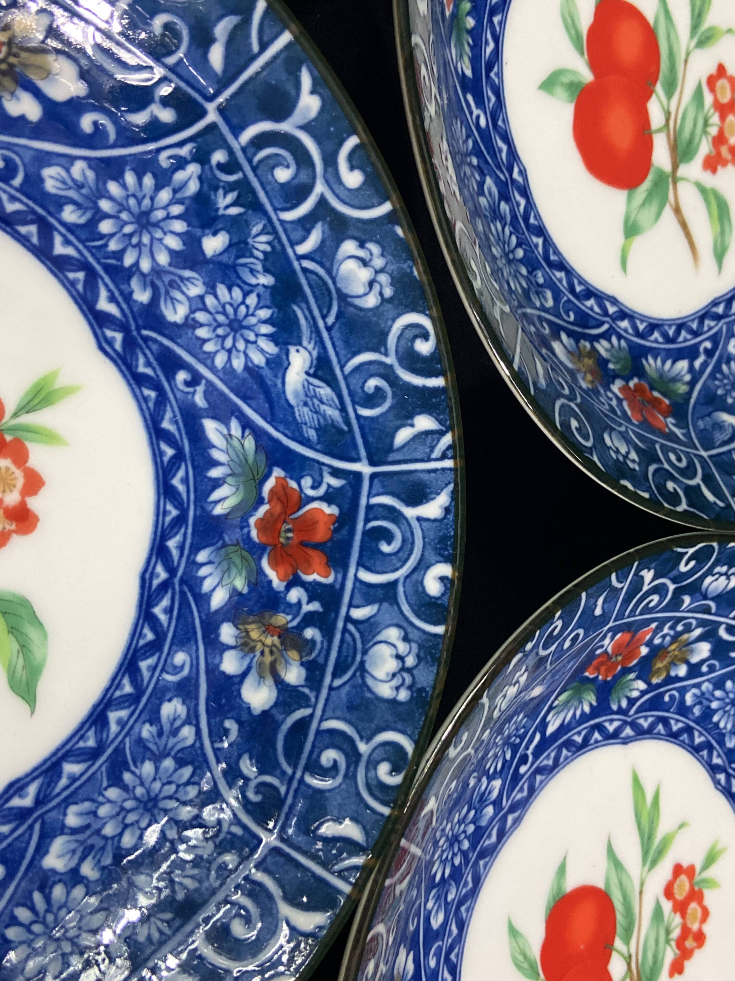 Set of 10 signed porcelain dessert plates with fruit decoration