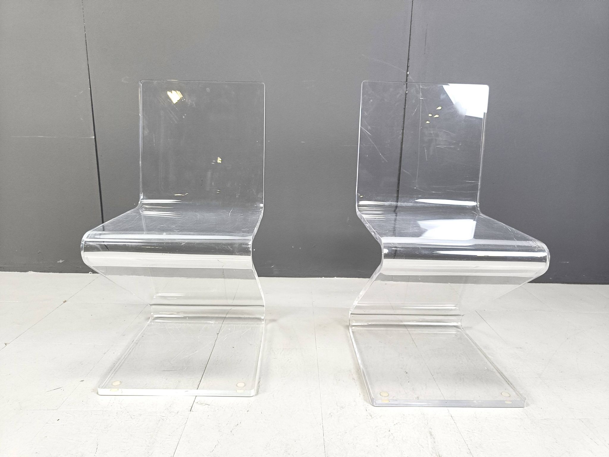 Pair of lucite zigzag dining chairs, 1980s