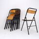 7 chaises pliantes en bois et métal noir, 1960
