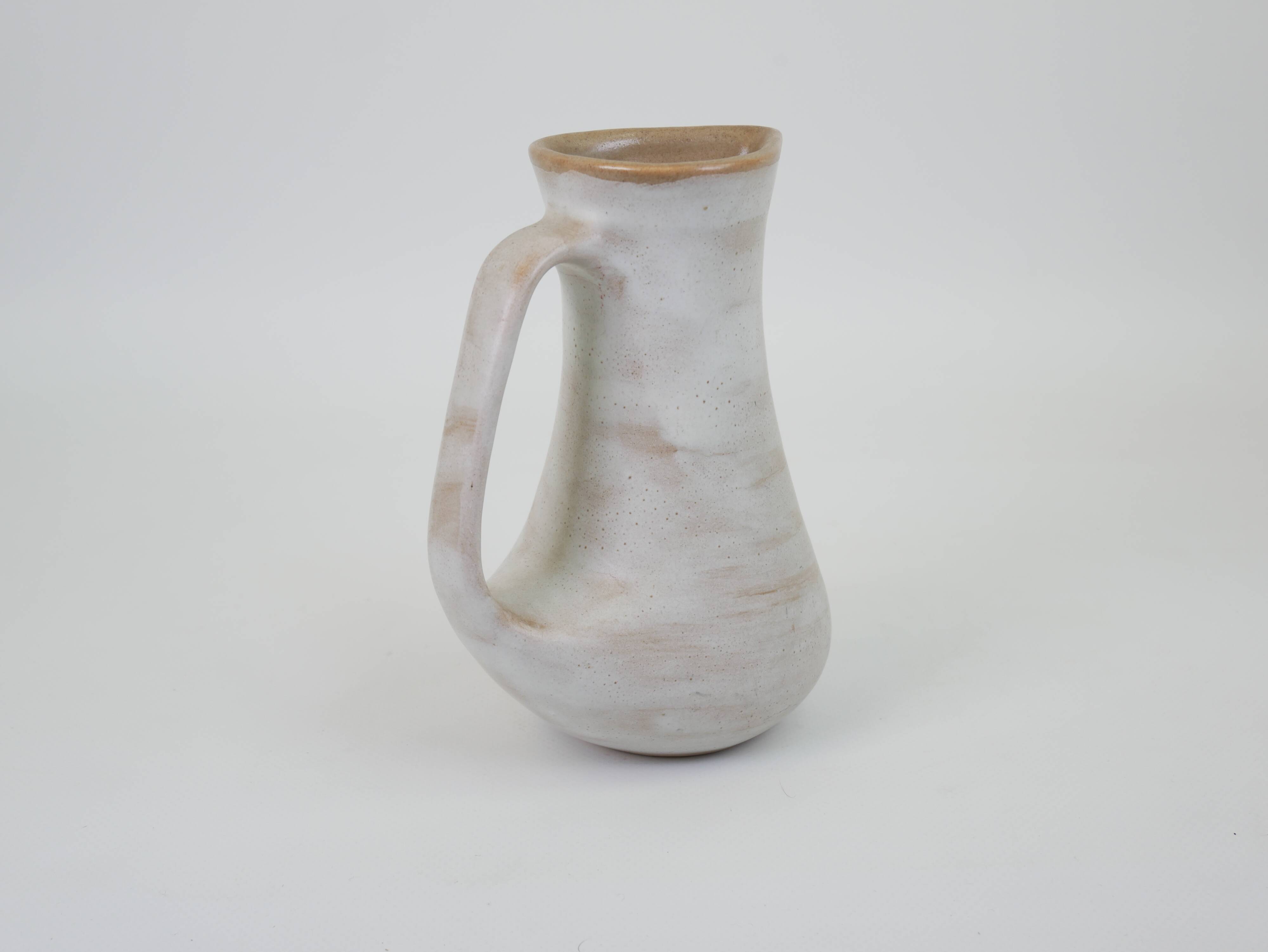 Signed white beige ceramic pitcher