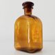 Vintage amber glass apothecary bottle