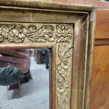19th century gilt mirror with flowers and foliage decor