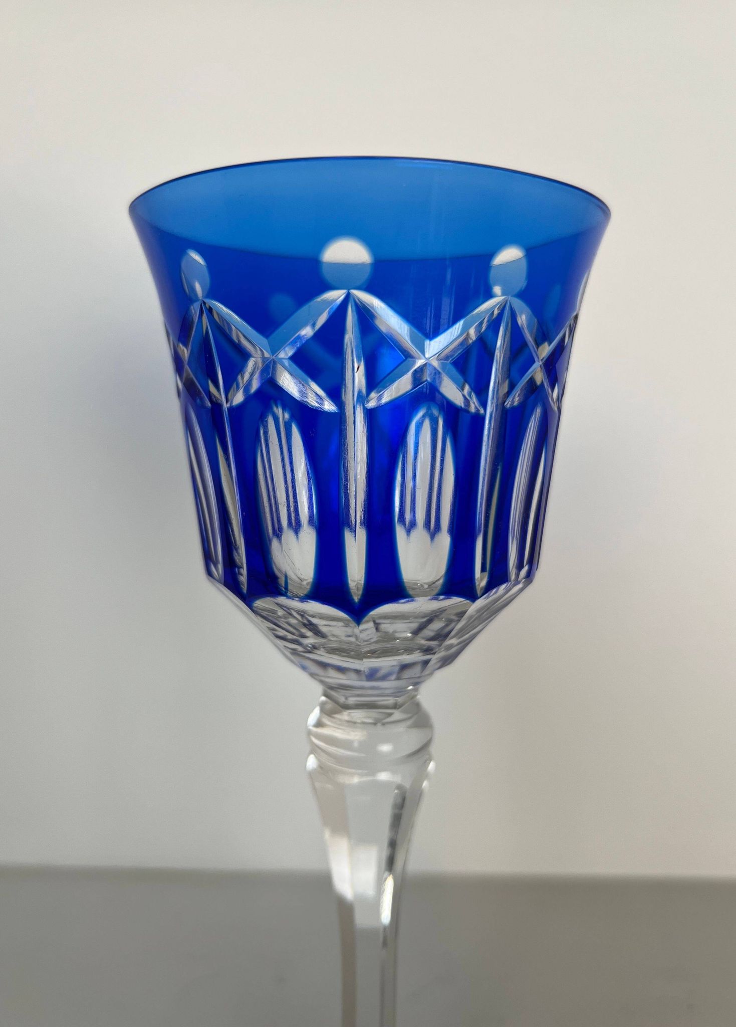 Set of twelve glasses in crystal tinted in different colours and cut with stars.