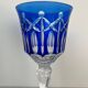 Set of twelve glasses in crystal tinted in different colours and cut with stars.