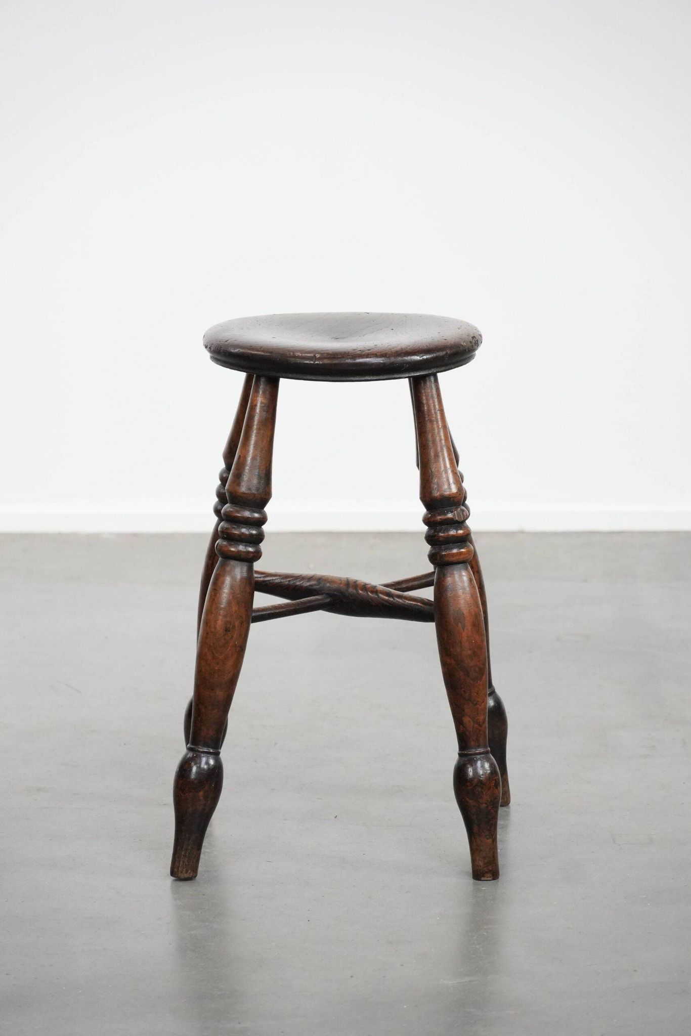 Antique English Windsor stool from the 18th century with a great patina