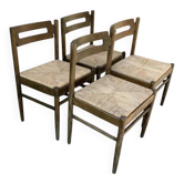 Set of 4 brown wooden dining chairs with straw seats, 1970s.