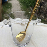 Ice bucket and golden spoon