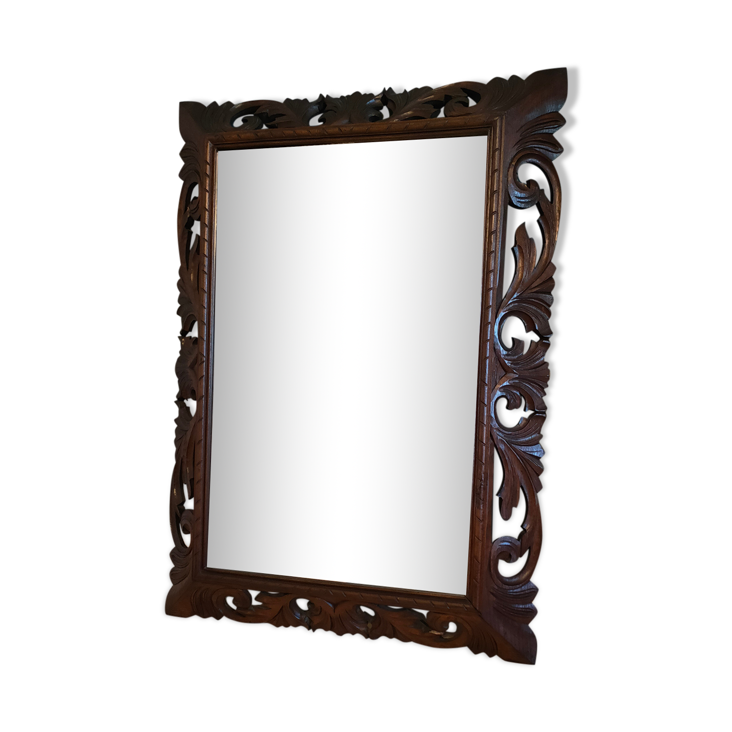 Antique mirror in openwork carved wood