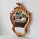 Vintage rococo mirror in gilded resin