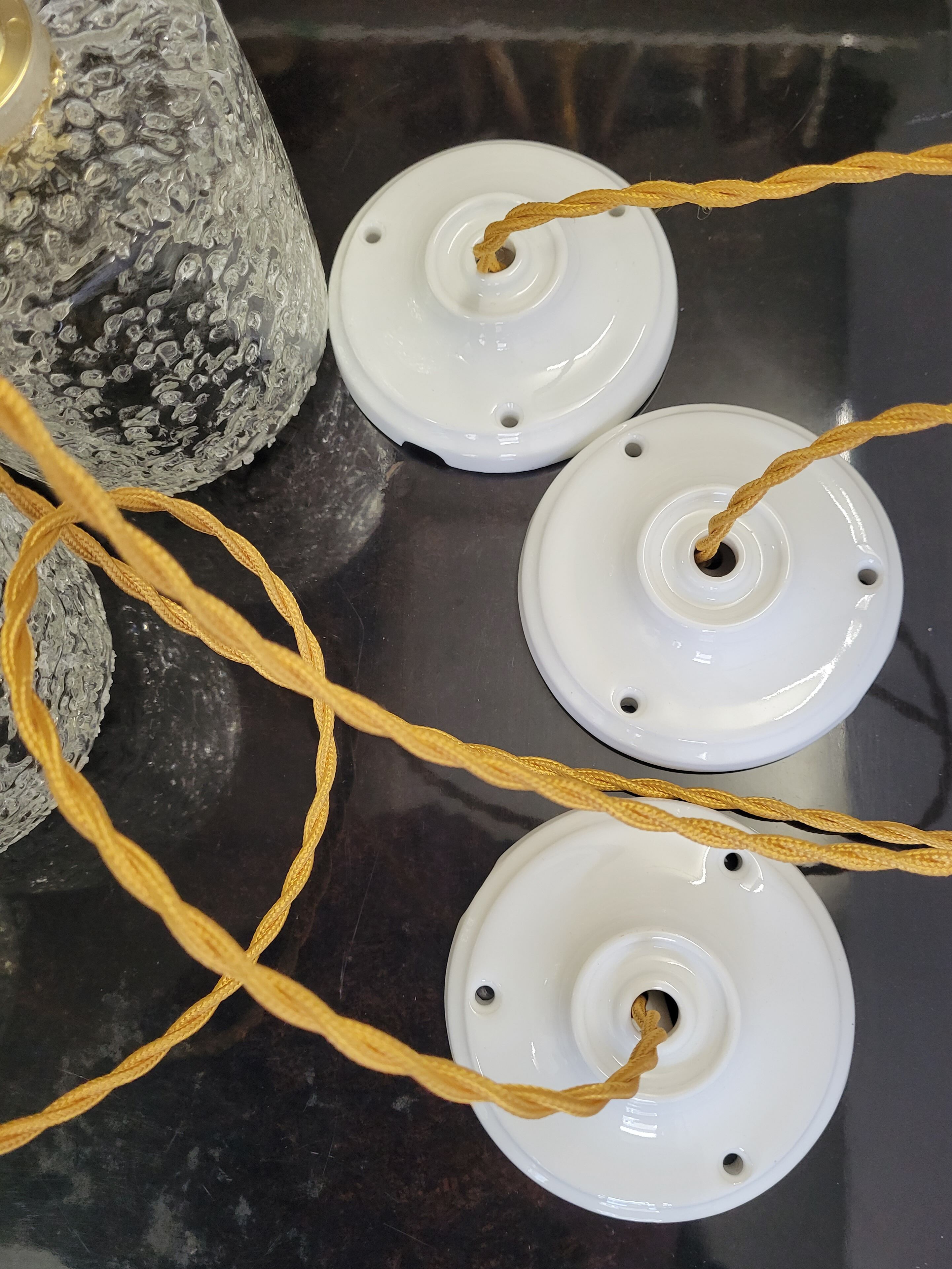 Trio of scrambled glass pendant lamps