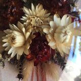 Old medallion frame of dried flowers of oval shape. To hang with velvet stripe.