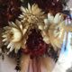 Old medallion frame of dried flowers of oval shape. To hang with velvet stripe.