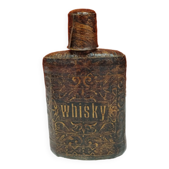 old whisky flask wrapped in imitation leather with relief