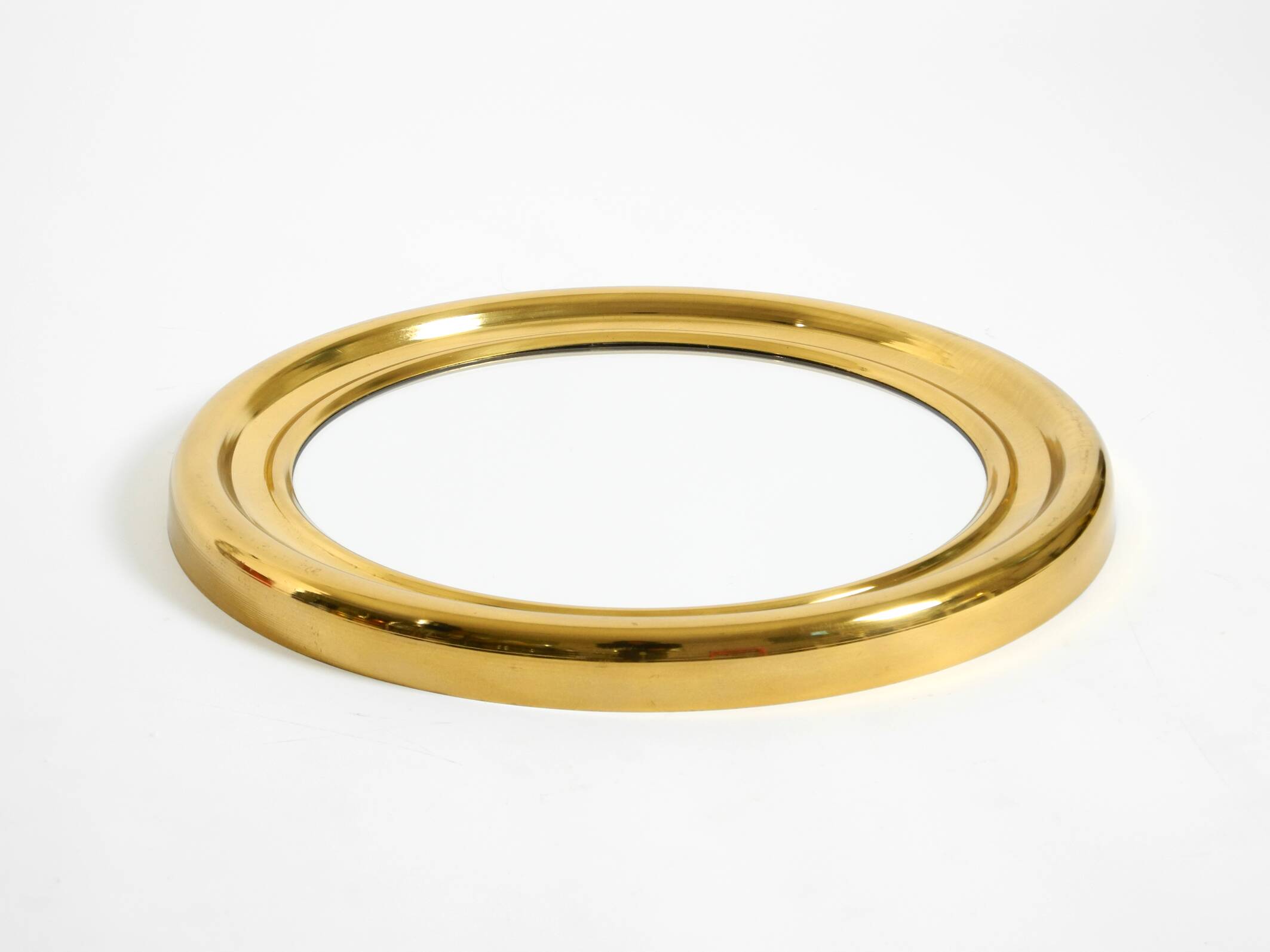Beautiful, heavy, round Italian brass mirror from the 1960s