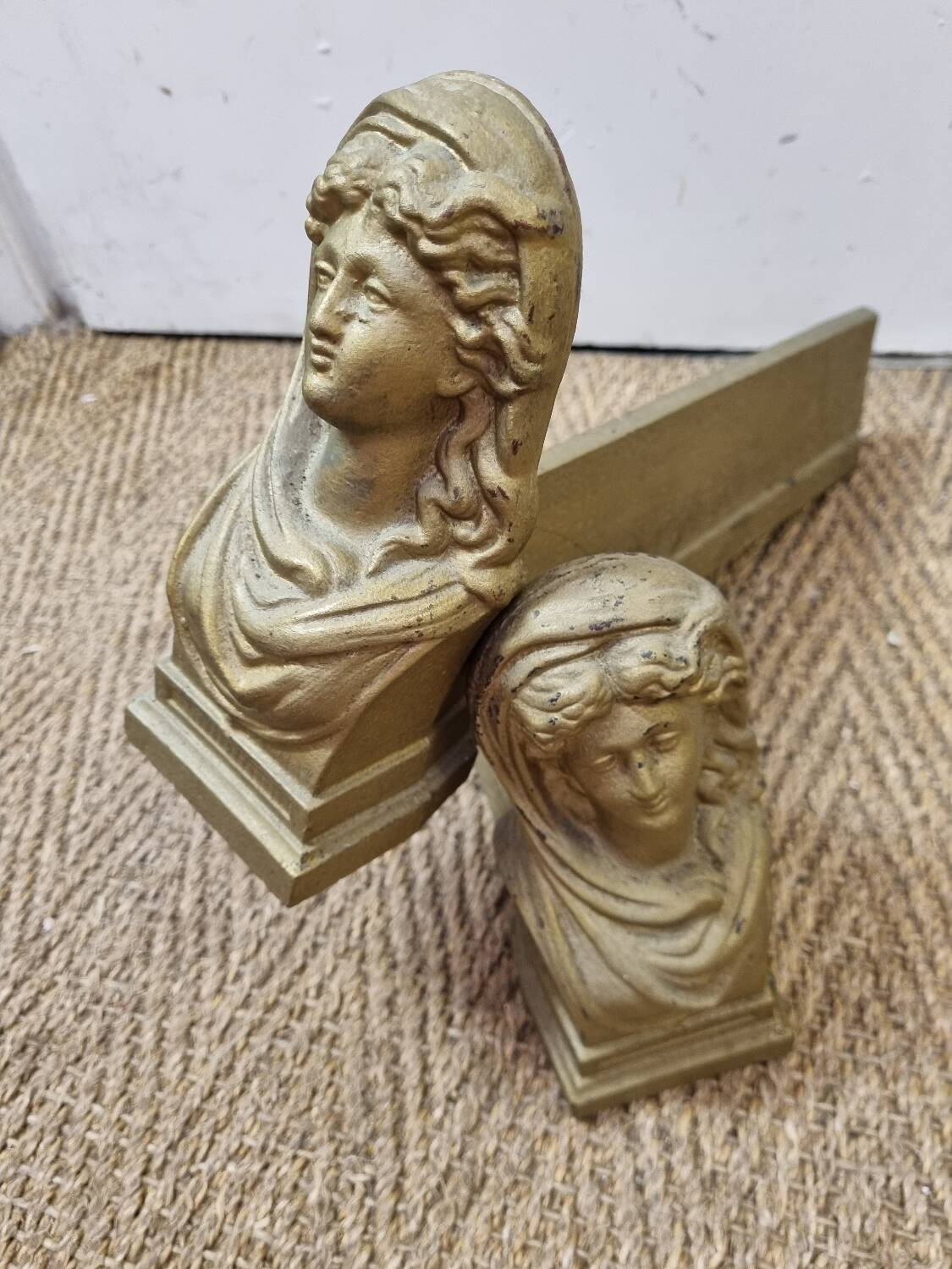 Cast iron andirons heads of women