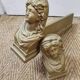 Cast iron andirons heads of women