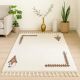 Ecru Berber rug with symbolic corner patterns.