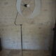 Flexible floor lamp, chrome, opaque white shade with metallic edges.