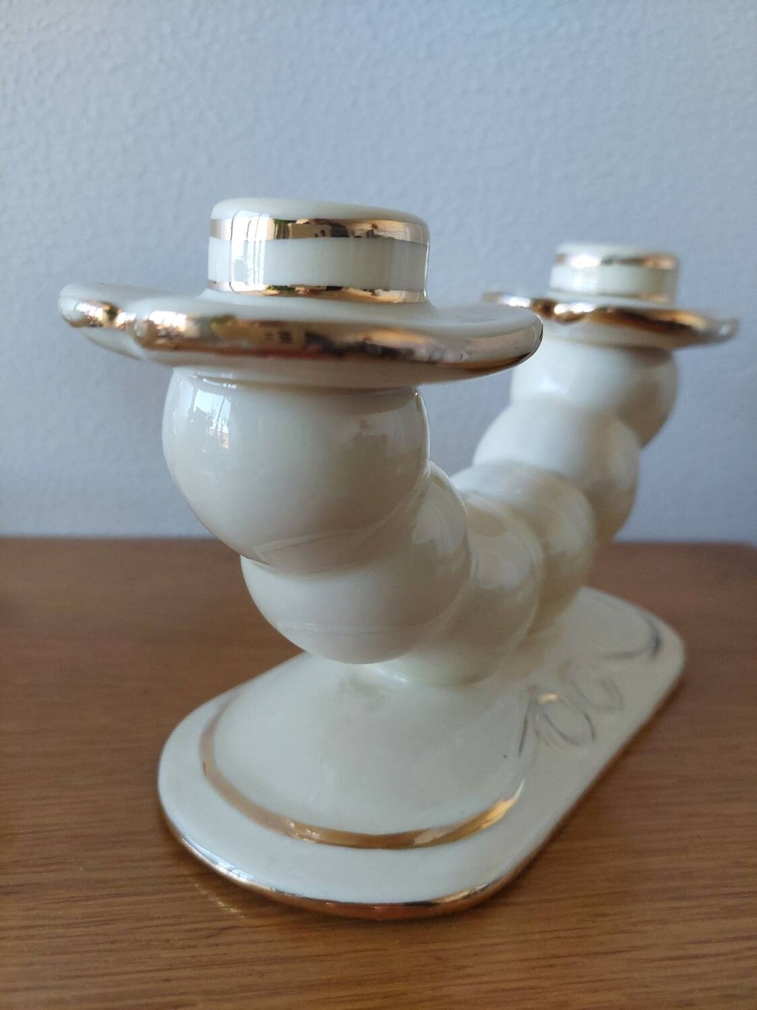 Pair of cream ceramic candlesticks with gold trim circa 1930-1950