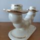 Pair of cream ceramic candlesticks with gold trim circa 1930-1950