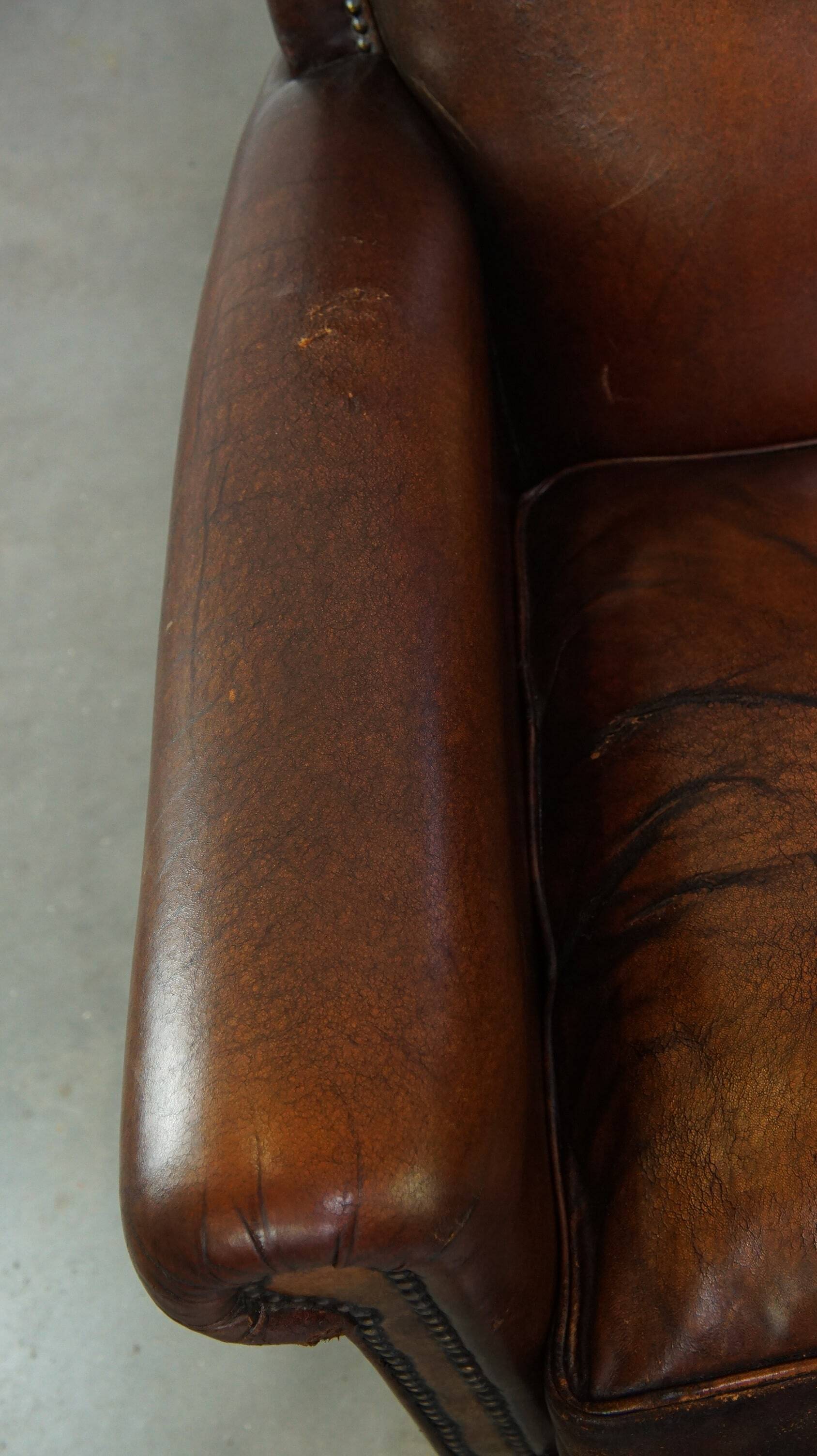 Vintage sheepskin armchair with beautiful warm colors and excellent seating comfort