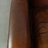 Vintage sheepskin armchair with beautiful warm colors and excellent seating comfort